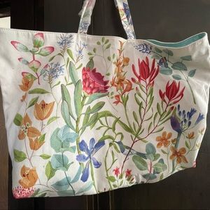 Two (2) Estée Lauder floral tote bags
